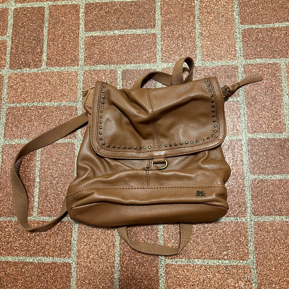 The SAK brown backpack purse